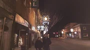 Hosts Katrina Weidman and Nick Groff underneath the Anderson Hotel sign.