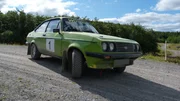 Finished Ford Escort during Test Drive, car on rally track, front of car 45 degree angle.