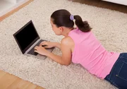 Young Beautiful Woman Using Laptop In Living Room Young Beautiful Woman Using Laptop In Living Room