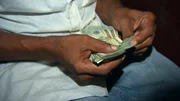New Orleans, Louisiana USA: A dealer counting money.