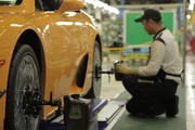 Toyota-city, Aichi Prefecture, Japan - Worker at Lexus Factory working on tires on LFA car.