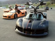 Austria - Models of Gumpert Apollo Enraged at Red Bull ring race track with doors