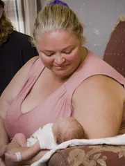 Amanda holds new baby Glenn.