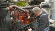 Adam refurbish a Volvo VNL 780 in the workshop.
