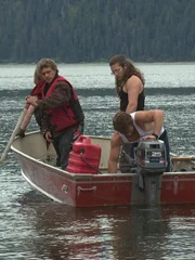 Matt Brown, Bam Bam Brown, Bear Brown and Gabe Brown taking the skiff to the Integrity.