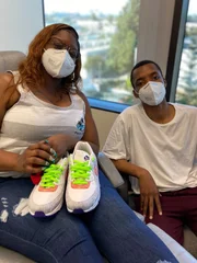 Aquila and Aron looking at camera in exam room