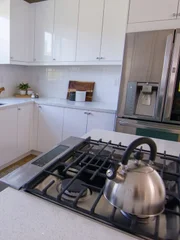 Kitchen Island After with cabinets and backsplash