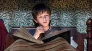 Jared (Freddie Highmore) st&ouml;&szlig;t auf ein mysteri&ouml;ses Buch, das ihm eine bislang unbekannte Welt offenbart.