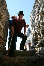 Rattlesnake dare devil Jackie Bibby is about to enter a den of snakes a dark root cellar.