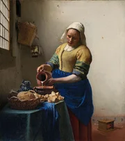 &bdquo;Die Milchmagd&ldquo; f&auml;ngt eine einfache Arbeitsszene voller Ruhe, Licht und feiner Details ein &ndash; typisch Vermeer.