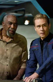 L-R: Dr. Emory Erickson (Bill Cobbs), Lieutenant Malcolm Reed (Dominic Keating)