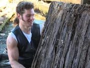 Gabe Brown dragging out an old, dirty box spring from the cabin.