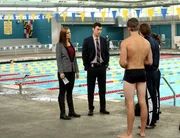 BONES: Brennan (Emily Deschanel, L) and Sweets (John Francis Daley, second from L) investigate the death of a college swim coach in the "The Drama in the Queen" episode of BONES.