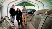 Car dealer and US vehicle specialist Klaus Borrmann shows Isabella and Chris Fuchs an alternative to the Chevy van they actually came to Route 66 Borrmann Motors in Hamburg to see: an old 1987 Cadillac hearse, as Isabella has always dreamed of owning her own hearse and has searched in vain until now.