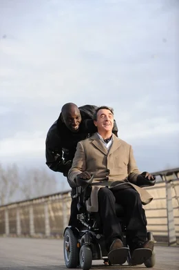 L-R: Driss (Omar Sy), Philippe (Francois Cluzet).