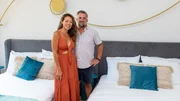Luke Shantz and Stephanie Sitt portrait in the Pool Room at their renovated hotel in Jaco, Costa Rica, as seen on Betting on Paradise, Season 1.