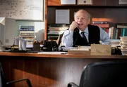 Dr. John Sturgis (Wallace Shawn)