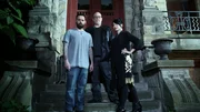 Full body hero shot of Shane Pittman (left), Dave Schrader (center), and Cindy Kaza (right) in front of Franklin Castle in Cleveland OH, as seen on Travel Channel's The Holzer Files.