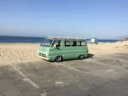 Dodge A100 on beach.