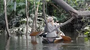 Myke and Ruth on Boat in Colombia paddling from behind.