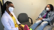 Dr. Ebonie with Jarrett Holt in Exam room
