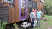 As seen on Tiny House Hunters, with tiny house expert Randy Jones, and her best friend Christian, potential home buyer Elena, admires the innovative design of this 240 sq. foot tiny house in Swannanoa, NC.