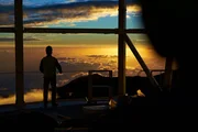 Thomas Rimmelle looking out at the sunset from the Daniel K. Inouye Solar Telescope in Haleakala National Park.