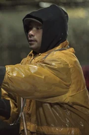 Deckhand James Tommy hauls a full pot on the Time Bandit.