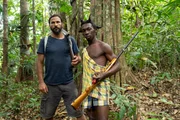 Hazen Audel and Fred standing in the Suriname jungle with shot guns.