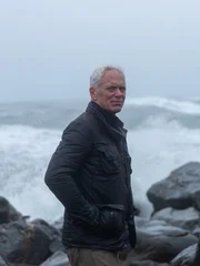 Extreme fisherman Jeremy Wade against dramatic backdrop of the choppy Atlantic sea