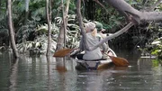 Myke and Ruth on Boat in Colombia paddling from behind.