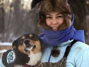Courtney Agnes with one of the dogs in her dog team.