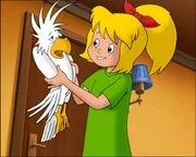 Bibi freut sich &uuml;ber den zugeflogenen wei&szlig;en Kakadu.