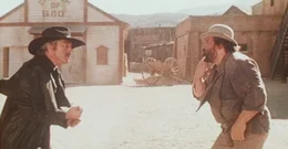 Ganz christlich bietet Buddy (Bud Spencer, r.) dem Gangster Colorado Slim (Riccardo Pizzuti, l.) seine linke Wange. Oder ist es nur ein Trick?