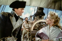 Kapit&auml;n Hornblower (Gregory Peck) bedankt sich f&uuml;r Lady Barbaras (Virginia Mayo) Hilfe bei der Pflege der Verwundeten nach dem Kampf.