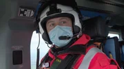 Paramedic Tyrone giving IV to Camera in helicopter.