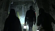 Paranormal investigators, Adam Berry and Amy Bruni, stand with Doug Francisco, a former miner, listening in the darkness for a spirit to answer their call.