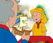 Caillou (re.) freut sich, als er ein altes Spielzeugboot seines Gro&szlig;vaters findet.