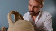 Paolo Maranzana inspects an amphora. (National Geographic)