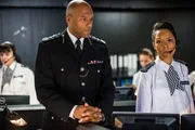 L-R: Chief Hazard (Colin Salmon), Intel Officer (Kemi-Bo Jacobs).