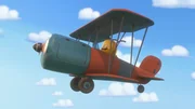 Kiwi fliegt mit seinem Flugzeug und ist gl&uuml;cklich.