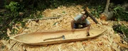 Hazen carving a wooden boat. (National Geographic/Laurence Hamilton-Baillie)