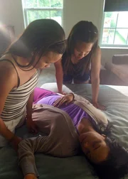 Jas and Tas find their mom passed out on the bed.