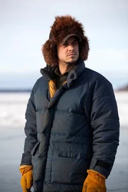 Chris Morse standing outside on the tundra.