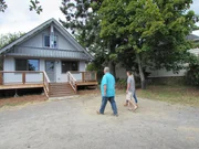Clients and agent in front of Tucker Cove, shown to clients Jayson & Katie Schmidt, on San Juan Island, Washington, as seen on HGTV's "Island Life"