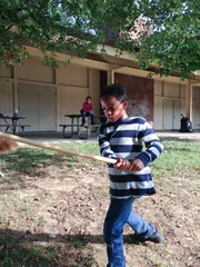 Young Jerome beating up a teddy bear and convincing his twin Tyrone to join in.
