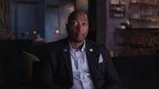 Sit down interview with Tyrone Dennis in a suit Sit down interview with Tyrone Dennis in a suit