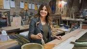 Host Alison Victoria applying brass to a custom front door.