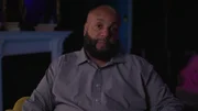 Derrick Parker in a blue button up shirt during sit down interview
