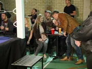 Chris kisses Makaela's hand at the boxing ring.